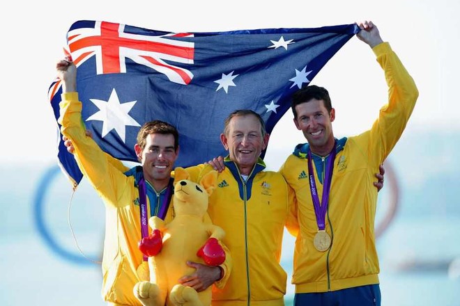 Matthew Belcher, coach Victor Kovalenko, and Malcolm Page show  their Gold medals at the 2012 Olympics, Weymouth © Associated Press/Francois Mori